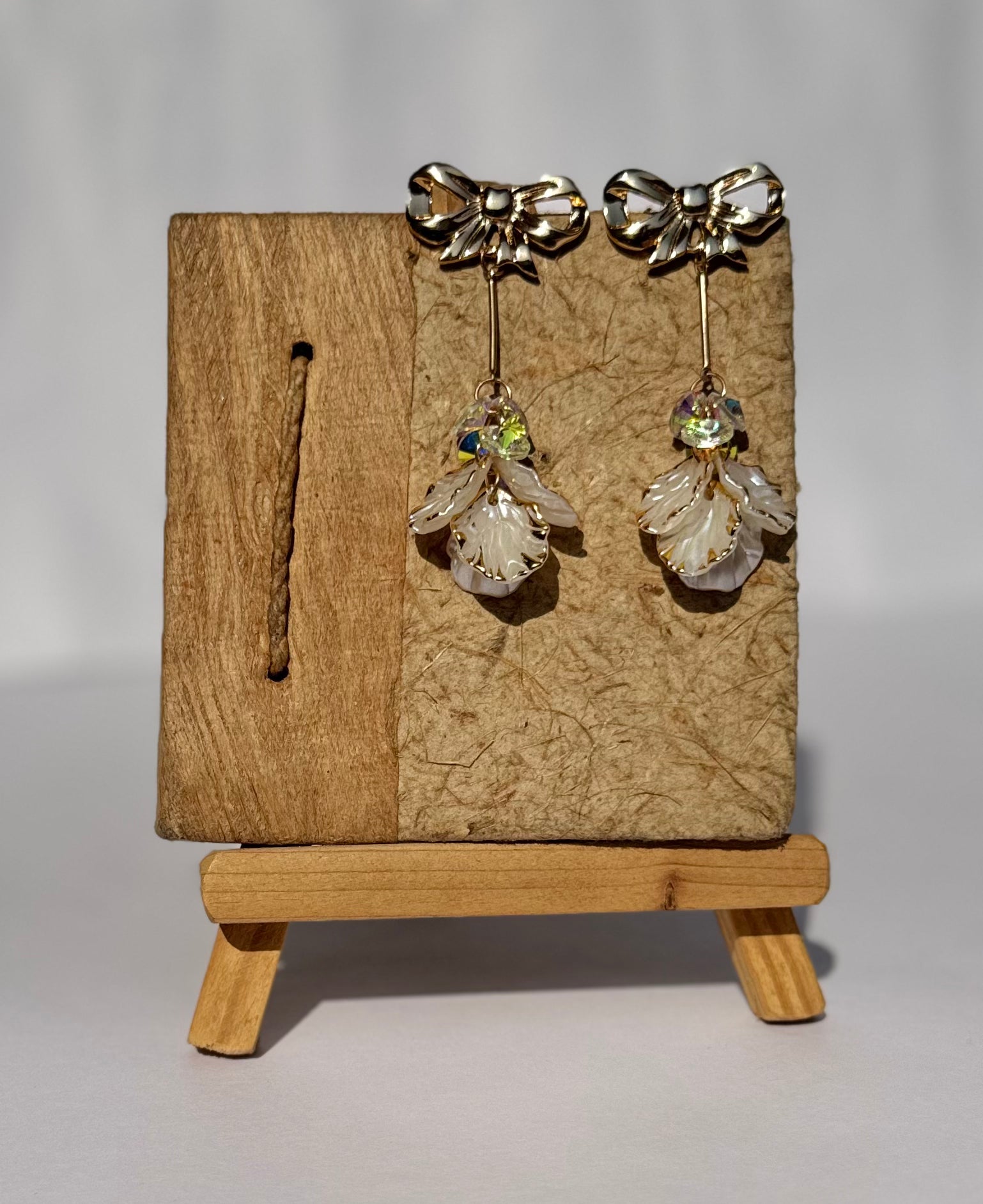 Golden Bow & Crystal Petal Dangle Earrings. MAYA LUXE.